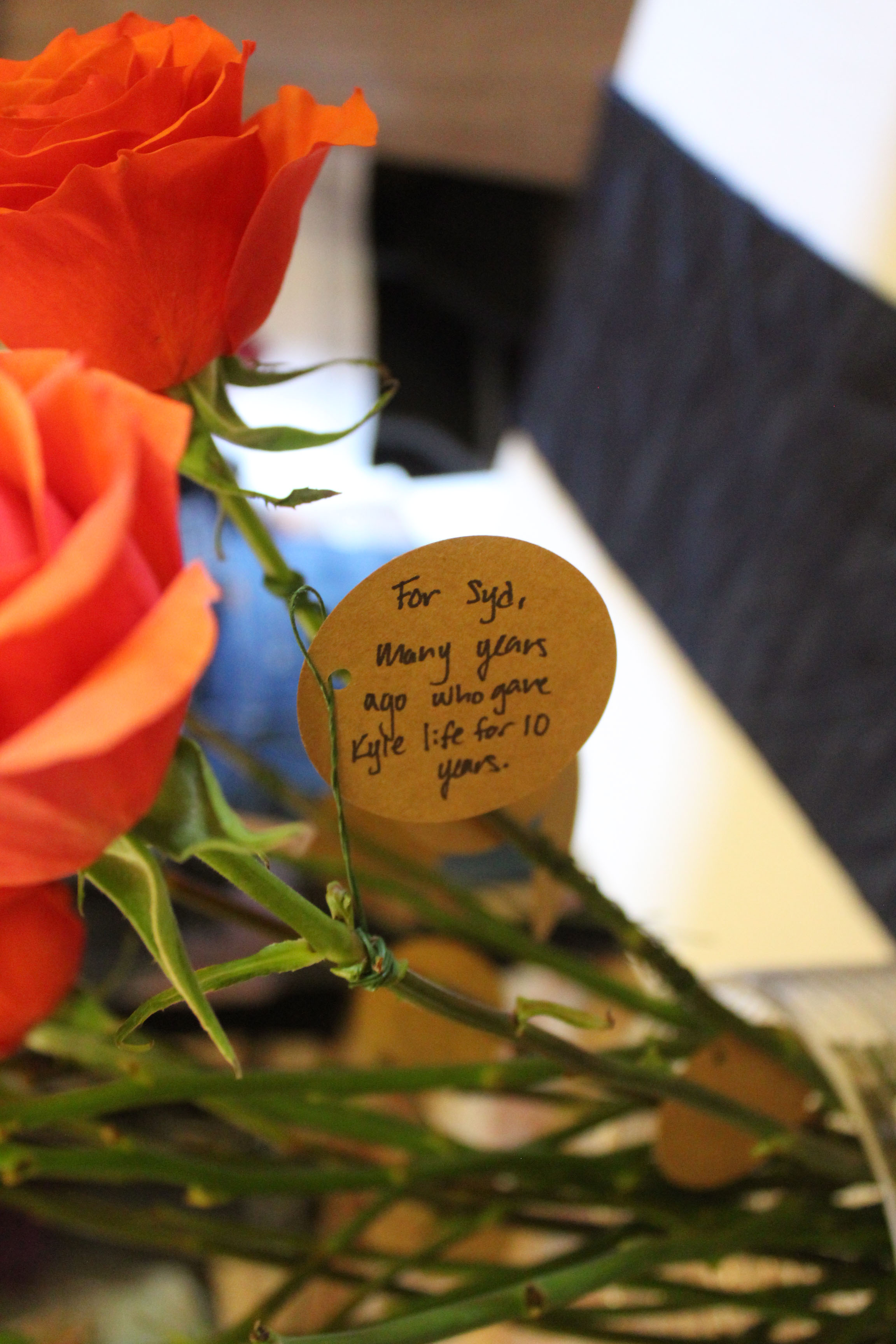 dedication message attached to rose "For Syd, many years ago who gave Kyle life for 10 years"